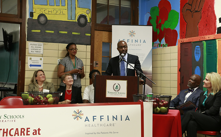 Jason Purnell speaks at the launch of the school-based health center at Normandy High School