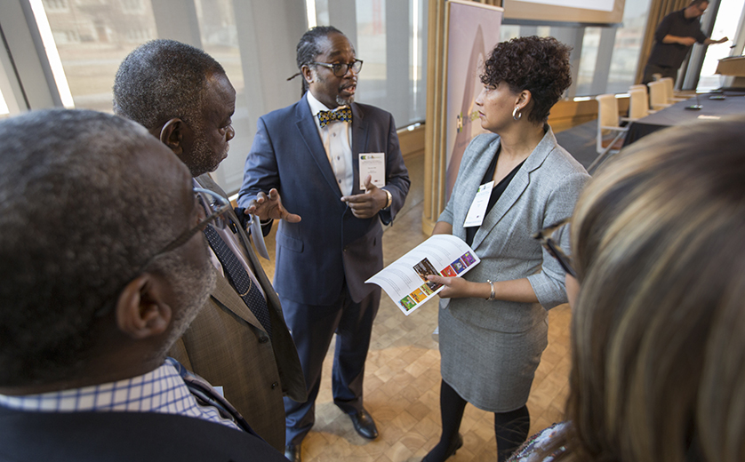 Professor Sean Joe speaks with a small group at the 2018 HomeGrown STL Summit
