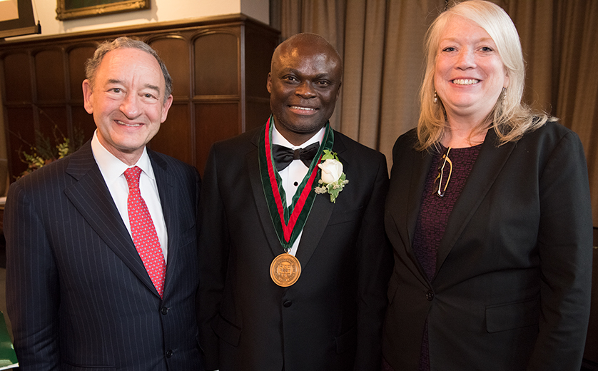 From left: Chancellor Mark Wrighton, Professor Fred Ssewamala, Dean Mary McKay