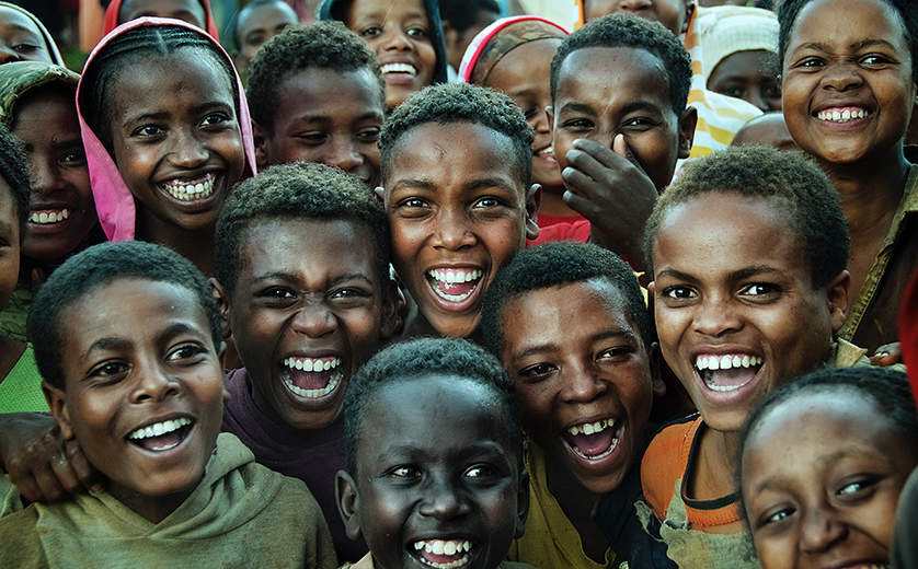 Group of smiling children and adolescents in Ethiopia.