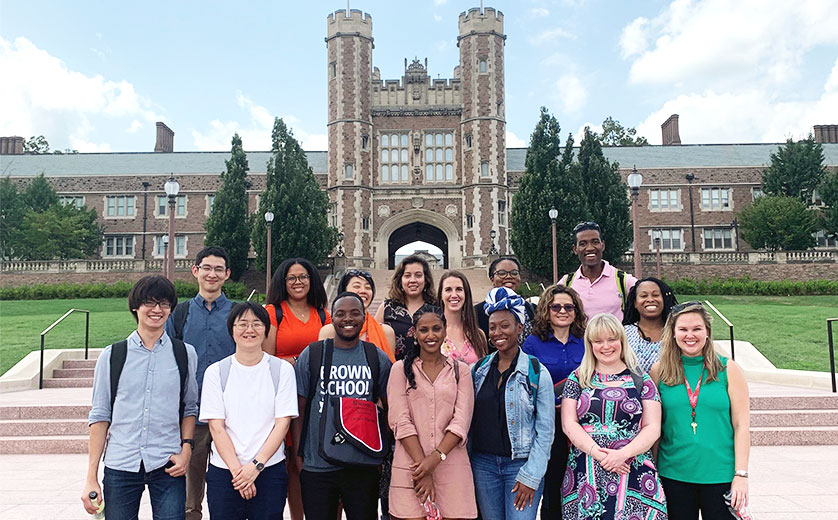 The newest cohort of PhD students on the steps of Brookings Hall.