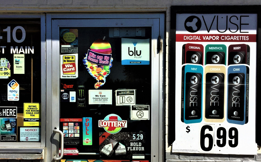 Photo of storefront with tobacco ads