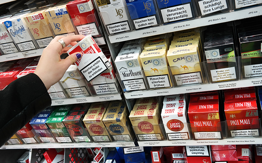 Cigarette cartons on a store shelf