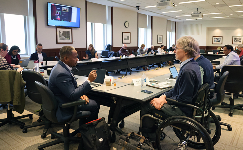 Brown School Professor Ross Brownson (right), the associate associate e​ditor of the Annual Review, chats with Vabren Watts, Director of Equity at Health Affairs, during April 24 meeting of scientific journal editors held at Washington University.
