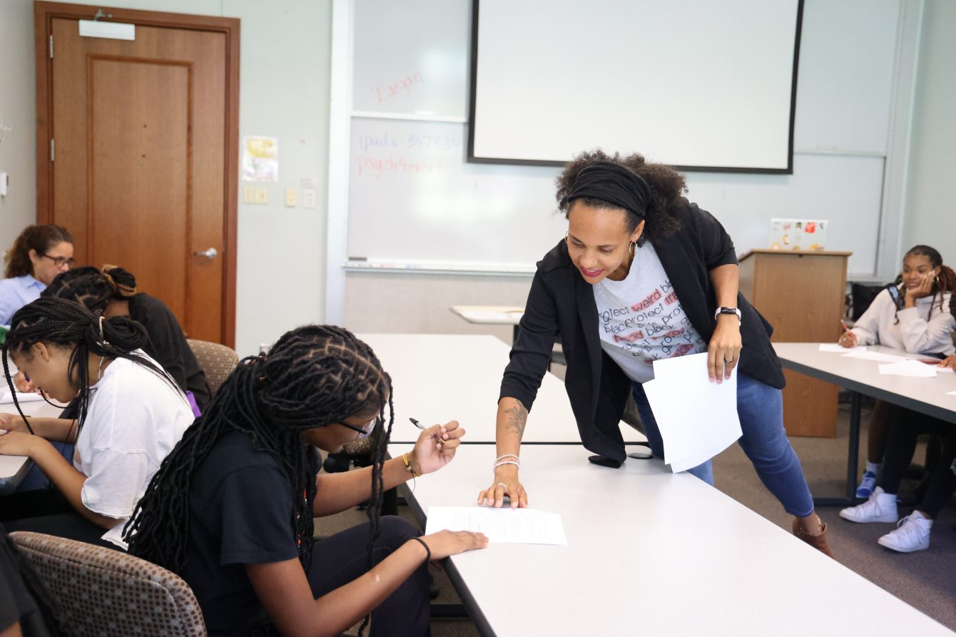 Sean Leath, Assistant Professor of Psychological & Brain Sciences, helps students during the summer STEM program for Black high school girls.